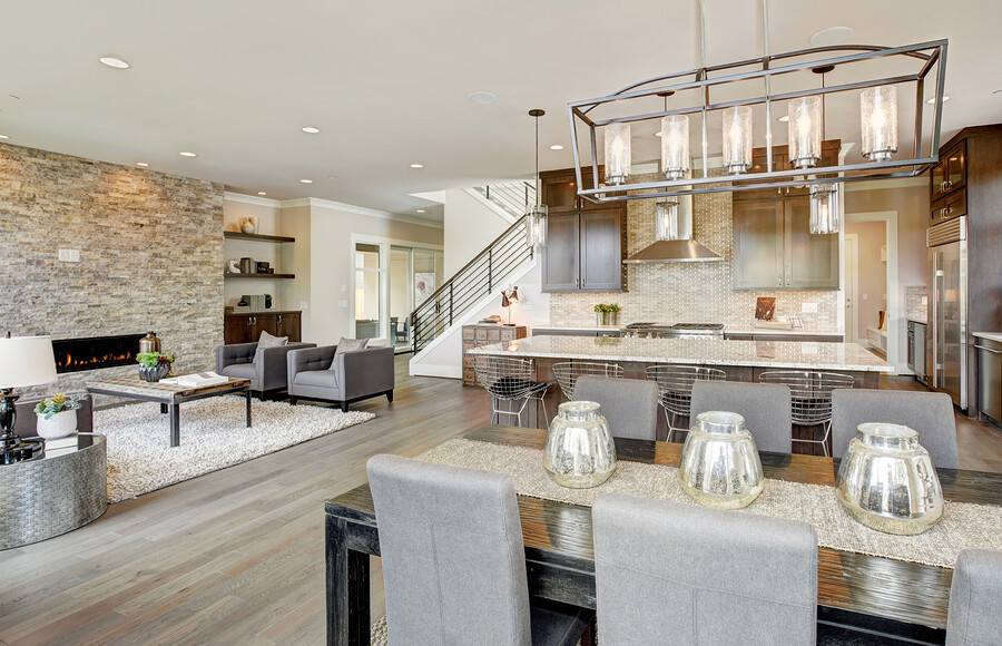 Open Floor Plan Luxurious New Construction kitchen equipped with appliances and dining room table