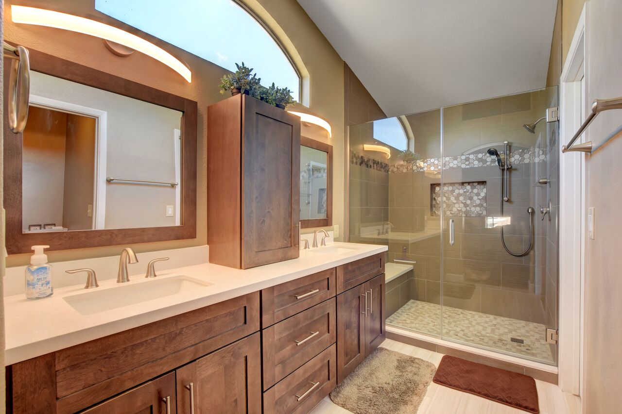 bathroom remodeled in las vegas with a new shower cabinets and mirrors