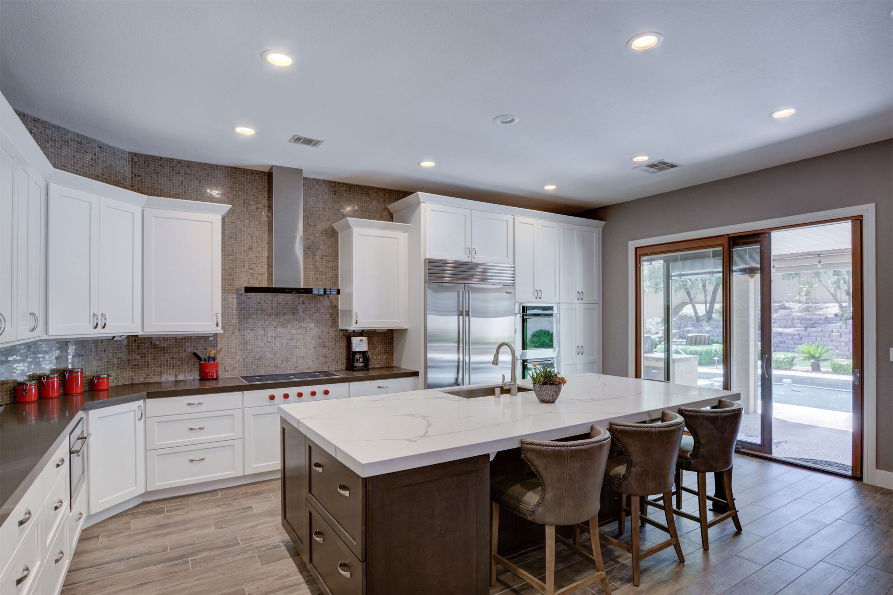 Kitchen with island counter and door to the outside